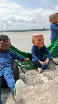 Ativistas simulam Lula, Trump e outros líderes mundiais dormindo em redes em ato em Belém