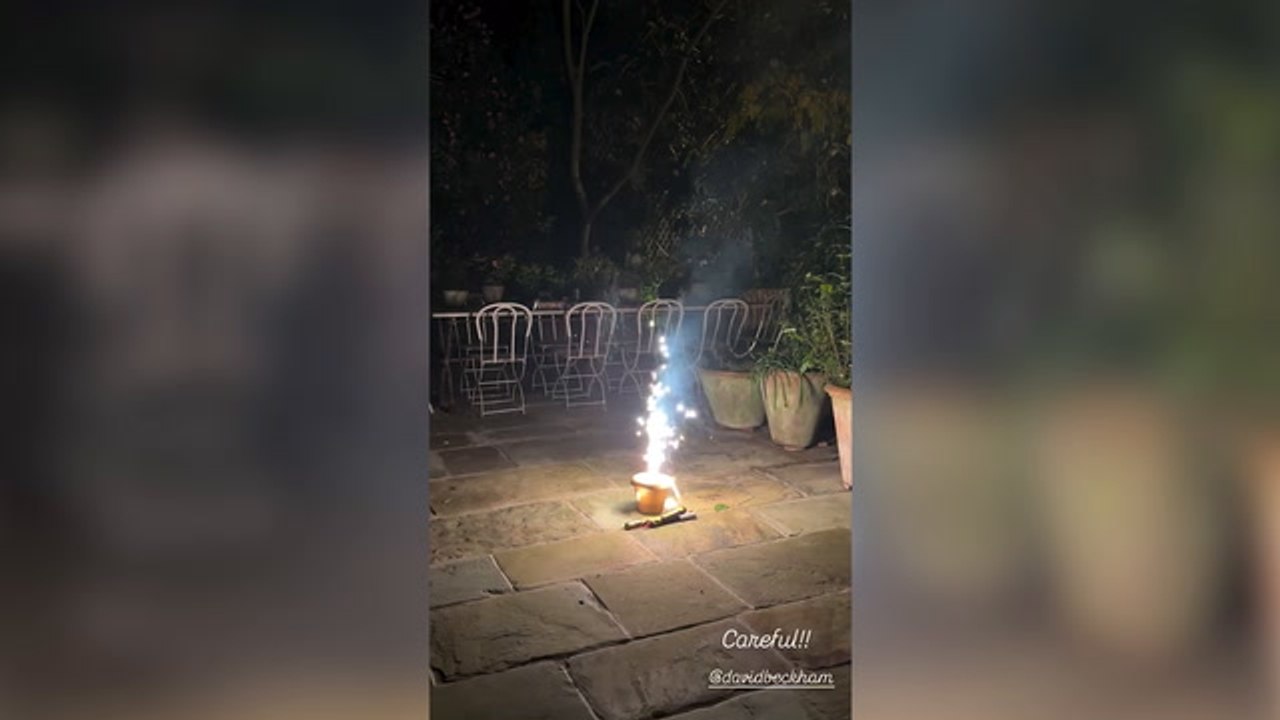 Sir David Beckham runs for cover as firework explodes in front of him