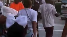 Guy smacks random kid in the street for no reason