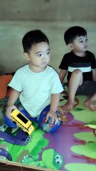 Baby Isaiah and Grey watching TV together