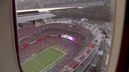 Air Force One, with Trump aboard, flies over football stadium ahead of game