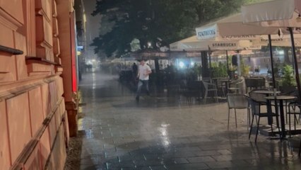 Embarrassing fall caught on camera as man slips during storm and narrowly escapes serious danger