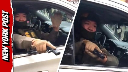 Moment ICE officer points gun at outraged Chicago protesters