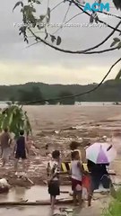 Bridge shakes wildly as deadly typhoon Uwan tears through Philippines