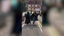 Alan Carr and Cat Burns dress up in their Traitors cloaks