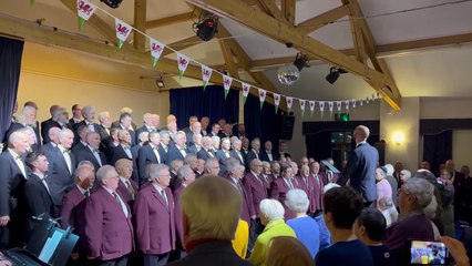 Monmouth and Dunvant Male Voice Choirs sing the Welsh National anthem at this year's St David's Day concert