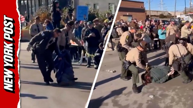 Anti-ICE protestors dragged away by police during tense clash outside Broadview facility