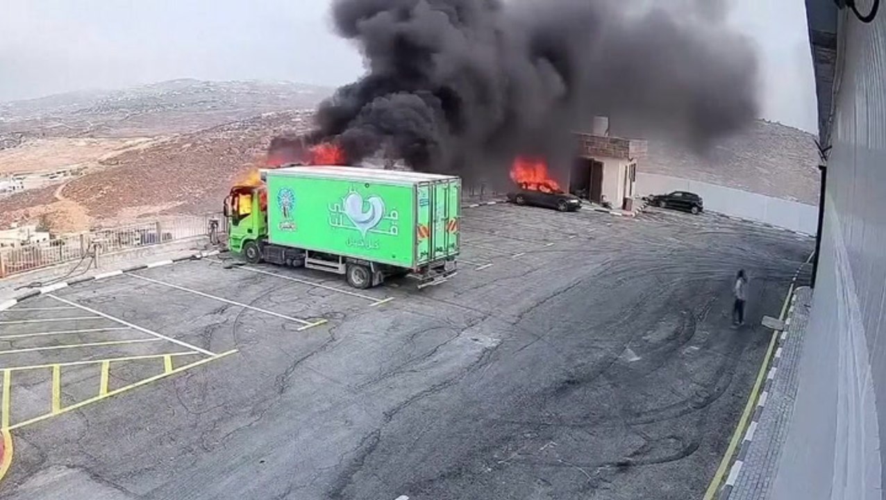 Masked Israeli settlers set fire to vehicles in attack on occupied West Bank