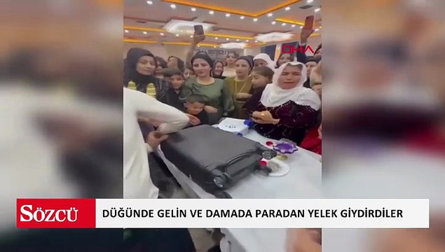 Düğünde gelin ve damada paradan yelek giydirip, taç taktılar