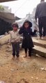 Children in Gaza under heavy rain