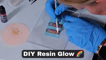 Tutorial video shows artist crafting rectangular-shaped handmade earrings using UV resin