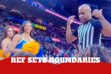 Referee forces cheerleaders off the baseline as he claims his space before Arizona–UCLA tipoff