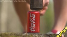 Crushing soda can with huge hammer