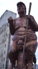 Climate protesters mock President Trump with 'orange plague' statue