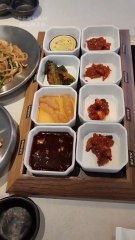 Today's afternoon menu: Several kinds of hot chili sauce. Fried noodles with soy sauce. Vegetable salad. Quail eggs.