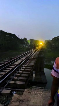 Near-Miss Train Accident! Man Survives Terrifying Fall from Railway Bridge in Bangladesh
