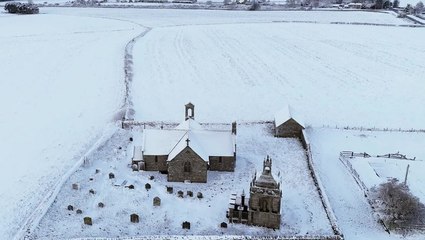 Snow blankets homes in breathtaking drone footage as weather warning issued