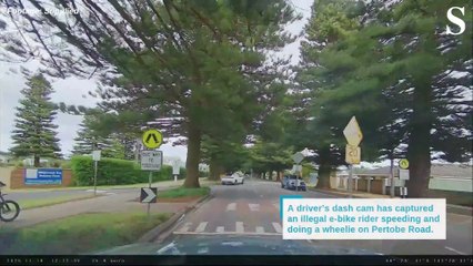 Dash cam footage captures dangerous illegal e-bike rider.