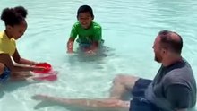 Kangaroo hopping into pool