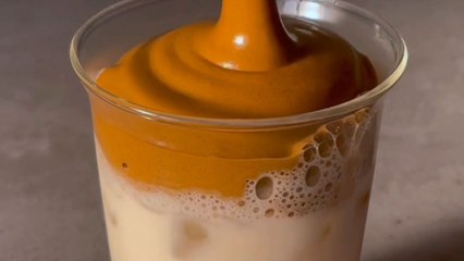 Aesthetic iced coffee with whipped dalgona cream that looks like a cafe treat