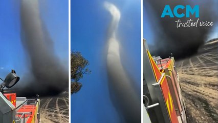 Huge 'smokenado' swirls over firefighters during rural blaze