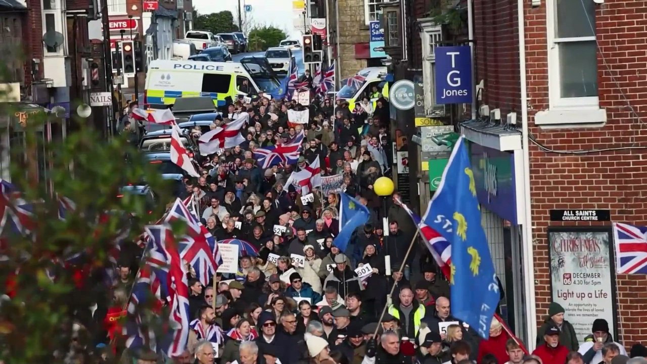 Hundreds Protest as ASYLUM SEEKERS to Be Housed at Military Site in English Town