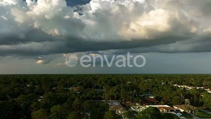 Landscape of Dark Ominous Clouds Forming on Stormy Sky Before Heavy Thunderstorm Over Rural Town