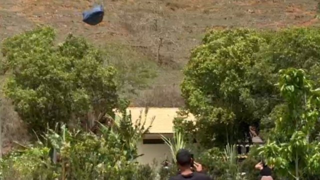 Strong winds lift a tent off the ground & turn it into a kite flying through the air