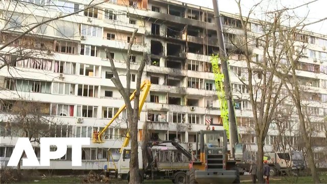 WATCH: Machines & Workers Clear Debris at Kyiv Site After Deadly Russian Strike | APT