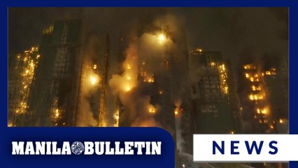 13 people killed in fire engulfing Hong Kong high-rise residential buildings, fire services say