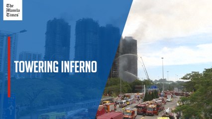 Hong Kong firefighters battle high-rise blaze more than 20 hours after it erupted