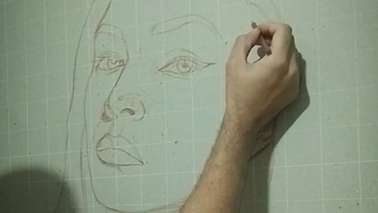 Artist pours his heart into painting a portrait of a girl