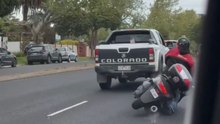 Heated exchange between truck driver and bike rider ends with the rider falling over