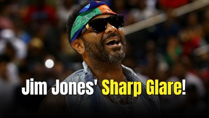 Jim Jones checks line-cutters while handing out Thanksgiving turkeys in Harlem during annual giveaway