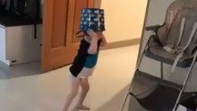 Mom puts bucket on toddler's head and he walks into a wall