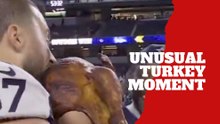 Jake Ferguson grabs the turkey and feeds it to everyone in a very unusual postgame celebration