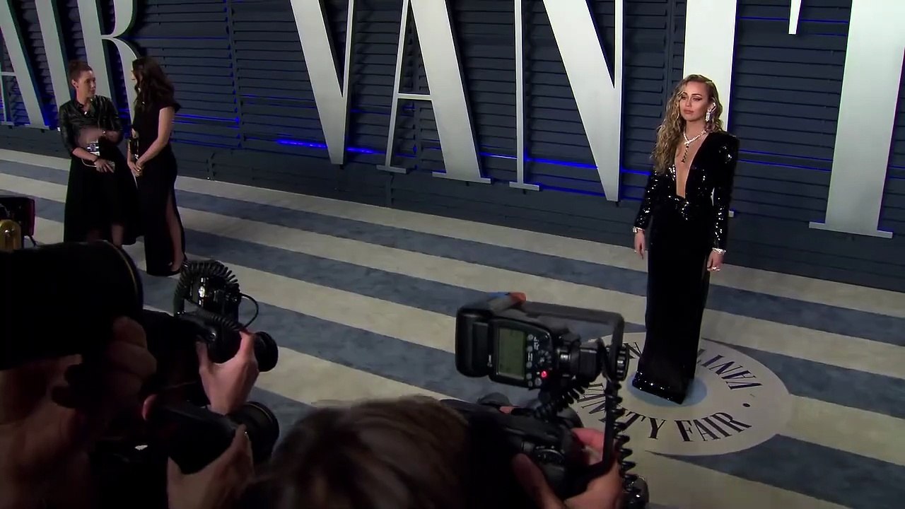 Miley Cyrus Stretches Her Body As She Rocks A Tiny Red Bikini In Sexy New Photo