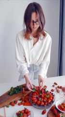 Women Preparing a Bowl of Strawberry Pie