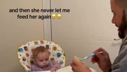 Feeding time turns hilarious as dad's botch causes food tray to lightly tap baby’s face
