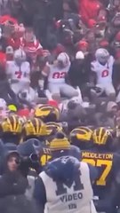 Michigan players guard 'M' logo after OSU's rivalry win