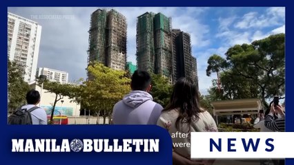 Flowers laid in tribute to those killed in massive Hong Kong fire