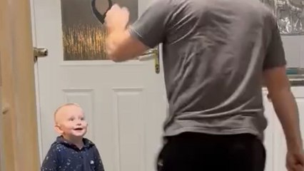 Man tries to entertain a baby but accidentally knocks over all the utensils
