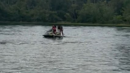 Girl backflips off jet ski for the first time and takes a funny fall