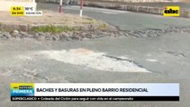 Baches y basuras en pleno barrio residencial
