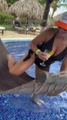 Woman Attempts Hammock Swing Entry