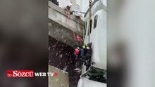 Köprüden sarkan TIR'dan son anda kurtarıldı