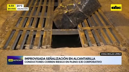 Usan un tambor para señalar una alcantarilla abierta sobre Molas López