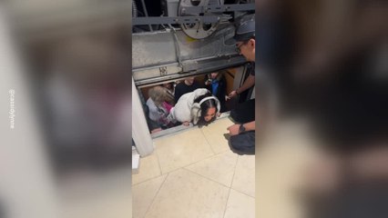 Chaotic Moment Family of 11 Gets Stuck in Elevator