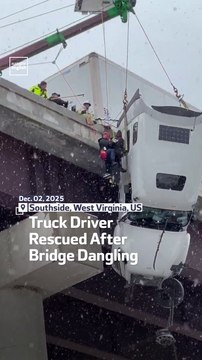 Truck Driver Rescued After Bridge Dangling