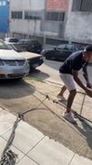 Man Tries Pulling Car With Belt, but It Snaps Midway